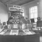 Image: orchards, bottles of wine and crops are on display in the middle of an exhibition room at the Royal Adelaide Show.  There is a sign on top of the display that reads: South Australian Agricultural Production