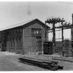 Image : Building with wooden power poles and transformers