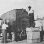 Image: two men washing a large van