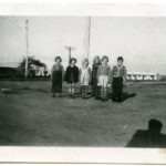 Image: group of children with buildings in background