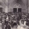 Image: People gathered within a chapel as a funeral takes place