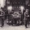 Image: Two soldiers standing guard next to a casket