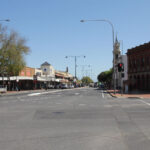 Image: Street scene of colonial buildings and Town Hall clock tower