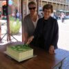 Image: two women cutting cake