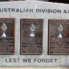 Three small plaques set in a stone