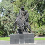 Image: sculpture of man on donkey carrying another man