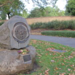 Image: stone memorial with bronze face