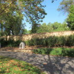 Image: concrete pathway lined with monuments