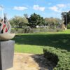 Image: memorial on a plinth designed as a red flame emerging from a circular bowl