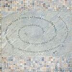 Image: words engraved in spiral shape in stone