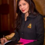 Image: woman seated in chair