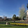 Image: bronze sculpture with city in background