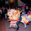 Image: Chinese dragon dancers watched by large crowd