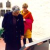 Image: two women looking at large outdoor plaque