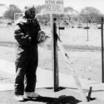 Image: man in protective clothing at Maralinga