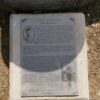 Image: Black and white plaque at foot of fountain