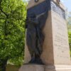 Image: Bronze female angel atop granite pillar