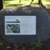 Image: Large graphic plaque set into granite boulder