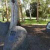 Image:  boulders with sculpture and plaques mounted on them