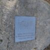 Image: bronze engraved plaque set in granite boulder