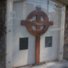 image: Cross of the Royal Australian Regiment and accompanying memorial plaques