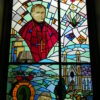 Stained glass window of the Bishop of Samogitia with a bear