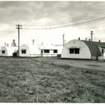 Image: row of curved tin buildings