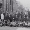 Staff and students outside of Queen's college