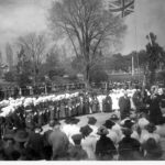 Image: group of people under Union Jack flag