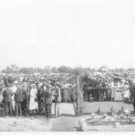 Image: view of crowd attending cemetery funeral ceremony