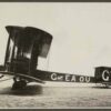 Image: black and white photo of bi-plane on the ground