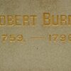 Text engraved in stone reading Robert Burns 1759-1796