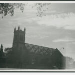 Image: a church with roof tiles removed.