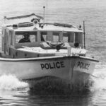 Image: A bow-on view of a motorboat under way at high speed