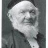 Image: a head and shoulders portrait of a man with a bushy white beard wearing a dark velvet cap.