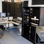 Image: audio preservation room filled with computers and other equipment such as playback systems