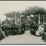 Image: group of people gathered under gazebo