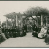 Image: group of people gathered under gazebo