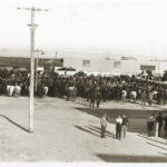 Image: men and horses gathered in a crowd for a strike