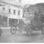 Image: A group of people in a car travelling along a street