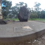 Image: bronze plaque on large stone