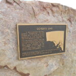 Image: bronze plaque on large stone