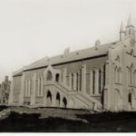 Image: This image shows the Wesleyan Church in 1925. The black and white image shows the church's front and side view, with a group of bicycles leaning up against the side of the building and a 1920s era car in the distance.