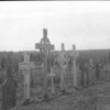 Image: black and white picture of grave site crosses